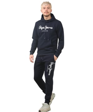 The Pepe Jeans London men's regular fit tracksuit set offers a soft and lightweight hoodie paired with matching joggers. The hoodie features ribbed details on the hood, cuffs, and hem, along with an adjustable hood and a kangaroo pocket for convenience. The joggers come with a waistband drawstring for a secure fit. Both pieces showcase the Pepe Jeans London Big logo on the chest for the hoodie and the left leg for the joggers. A decorative inner neckband with an all-over logo adds a stylish touch. Made from 100% sustainable cotton, the fabric consists of 65% cotton and 35% polyester. The set is a washable machine for easy maintenance.