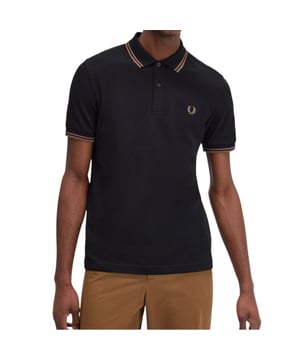 The Twin Tipped Fred Perry Polo Shirt by Fred Perry is a short sleeved polo shirt that has been made from Fred Perry's classic cotton piqué, in a contemporary adaptation of Fred's famous streamlined fit. Available in a diverse range of colourways - each with their own unique story. Featuring the signature Fred Perry wreath logo to the chest and twin tipping to the collar and cuffs.