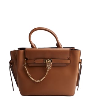 Our Michael Kors Hamilton Legacy satchel is as functional as it is bold, destined to become an icon. Crafted from luxurious leather with adjustable side gussets, it features a sophisticated link chain pendant that adds a decorative touch.

 Details:

 - Accessory Type: Satchel Bag.
 - Material: Cowhide.
 - Texture: Smooth.
 - Hardware: Gold tone.
 - Interior details: 3-slot plain back pocket, 3 compartments: 1 with zipper closure.
 - Exterior details: Decorative chain with pendant, decorative side bows.
 - Detachable and adjustable shoulder strap for carrying.
 - Top handles to carry as a handbag.
 - Closure: Main zipper.

 Each of Michael Kors' accessories collections boasts a strong identity, offering a fresh mix of timeless trends, colors, and silhouettes, combined with urban style and attitude. Each women's satchel designed by Michael Kors is an affordable luxury with a touch of modern, unexpected, and comfortable glamour, offering a piece for every occasion.
 Measures: 39.4 cm x 24.1 cm x 15.2 cm
 Composition: 100% Leather
 Care:
Clean with a soft, dry cloth.
 Avoid prolonged exposure to the sun and humidity.
 Do not apply abrasive products to the skin.
 Avoid contact with liquids and rough surfaces.
