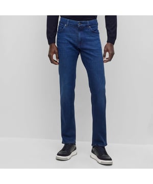 Men's Boss Maine Slim-Fit Jeans. These classic straight-leg jeans, made from premium cotton, feature five pockets, belt loops, and a zip fly with button fastening. Finished in a solid color with open cuffs and Boss branding, they offer both comfort and sophistication. Material: 60% Cotton, 39% Lyocell, 1% Elastane. Ref: 50496199430.