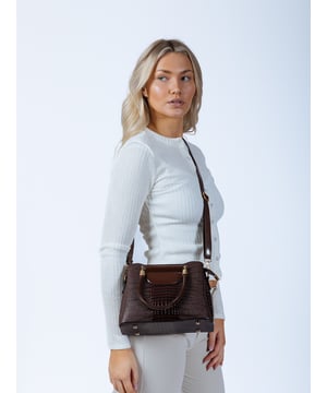 Stay stylish prepared for the season with this chic, patent croc bag. The perfect medium-sized bag for everyday errands, it features multiple compartments for easy organisation. With a versatile top handle and a crossbody strap, this bag effortlessly transitions from day to evening. The rich gradient brown hue makes it easy to pair with any outfit.