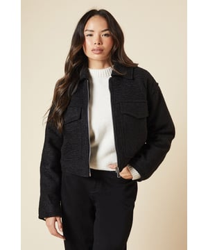 Chic collared jacket with zip front closure
        Versatile cropped length for layering
        Functional front pockets for practicality
        Textured woven fabric adds visual interest
        Long sleeves for warmth and style
    
    This Dorothy Perkins jacket is the perfect addition to your smart-casual wardrobe. The zip front detail and collared neckline create a polished look, while the cropped length allows for effortless layering over dresses or high-waisted trousers. Style it with a sleek midi skirt and ankle boots for a sophisticated brunch ensemble, or pair it with tailored trousers and heels for a more formal occasion. The versatile design makes it ideal for transitioning from day to night, whether you're attending a baby shower or meeting friends for dinner. The textured fabric adds a touch of elegance, making this jacket a go-to piece for the fashion-conscious woman in her 30s who appreciates trend-led styles without compromising on sophistication.