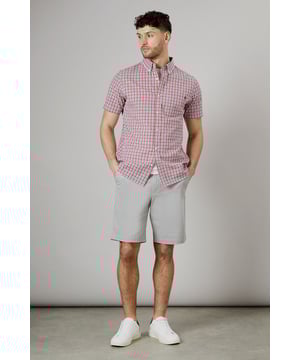 Classic button-down collar for a timeless look
        Short sleeves perfect for warmer weather
        Versatile check pattern adds visual interest
        Single chest pocket for a functional touch
        Back pleat for enhanced comfort and movement
    
    This Maine casual check shirt is a wardrobe essential that combines style and comfort effortlessly. The woven fabric ensures a crisp appearance while allowing breathability, making it ideal for various casual occasions. Style it with light grey chino shorts and white trainers for a relaxed weekend look perfect for family gatherings or casual outings. For a smart-casual ensemble, pair it with dark denim jeans and desert boots. The versatile check pattern allows for easy coordination with solid-coloured bottoms, making it a go-to choice for your everyday wardrobe. Whether you're heading to a backyard barbecue or meeting friends for a casual lunch, this shirt will keep you looking sharp and feeling comfortable throughout the day.
