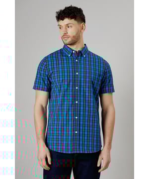 Vibrant tartan check pattern in bright blue tones
        Short sleeve design for warm-weather comfort
        Button-down collar for a smart-casual look
        Woven cotton fabric for breathability
        Versatile fit suitable for various body types
    
    This Maine short sleeve shirt presents a perfect blend of casual charm and smart styling. The eye-catching tartan check pattern in bright blue hues adds a pop of colour to your wardrobe, making it an ideal choice for those seeking to inject some personality into their everyday attire. Whether you're heading to a family barbecue or a casual Friday at the office, this shirt offers versatility in spades. Pair it with dark wash jeans and white trainers for a laid-back look, or dress it up with chinos and loafers for a more polished ensemble. The button-down collar adds a touch of refinement, while the short sleeves keep you cool and comfortable during warmer days. Crafted from woven cotton, this shirt ensures breathability and ease of movement, making it a go-to option for long summer days or relaxed weekend outings. Its adaptable fit flatters various body types, making it a wardrobe staple that you'll reach for time and time again.