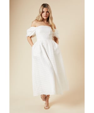 Elegant seersucker midi dress with square neckline
        Off-shoulder design with voluminous puff sleeves
        Fitted bodice with empire waistline
        Full skirt with subtle pleating for added volume
        Textured fabric adds depth and visual interest
    
    Make a statement at your next special occasion with this stunning seersucker midi dress from Dorothy Perkins. The square neckline and off-shoulder design create a flattering silhouette, while the puff sleeves add a touch of drama. The fitted bodice cinches at the waist before flowing into a full, pleated skirt that hits mid-calf, perfect for showcasing your favourite heels. Ideal for weddings, garden parties, or sophisticated brunches, this dress can be styled with strappy sandals and delicate jewellery for a refined look. For cooler evenings, drape a lightweight shawl over your shoulders. The textured seersucker fabric not only looks chic but also provides comfort and breathability, making it a versatile choice for various events throughout the season.