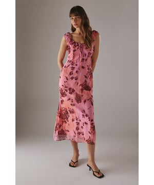 Chiffon fabric with floral print for a light, airy feel
        Double-layered design for added movement and depth
        Ruffle detailing along neckline and shoulders
        Midi length for versatile styling options
        Open back design with delicate ruffle trim
    
    This enchanting midi dress radiates effortless femininity with its flowing chiffon fabric and captivating floral print. The double-layered design adds a touch of sophistication, while the ruffle detailing along the neckline and shoulders creates a romantic silhouette. Perfect for a variety of casual occasions, this dress can be styled with flat sandals for a relaxed daytime look or dressed up with heeled mules for evening gatherings. The open back with ruffle trim adds an unexpected twist, making it an ideal choice for garden parties or summer weddings. Layer with a lightweight cardigan for cooler evenings or pair with statement earrings to enhance its feminine charm. This versatile piece from Warehouse embodies confidence and style, making it a must-have addition to your wardrobe for those moments when you want to feel both comfortable and effortlessly chic.