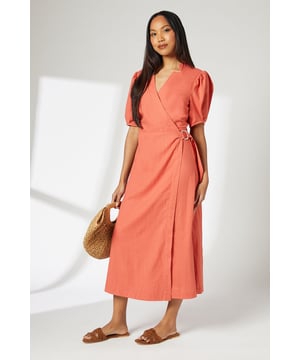 Elegant wrap design with adjustable side tie
        Flattering V-neckline and midi length
        Puff sleeves add a touch of drama
        Lightweight linen blend fabric for comfort
        Versatile style suitable for various occasions
    
    This Principles wrap dress embodies effortless chic for your daytime wardrobe. The wrap silhouette creates a flattering shape, while the puff sleeves add a contemporary twist to the classic design. Perfect for casual events or family gatherings, this dress can be styled with flat sandals and a woven tote for a relaxed look. The lightweight linen blend fabric ensures comfort throughout the day, making it ideal for warm weather outings. For a more polished ensemble, pair with wedge espadrilles and delicate gold jewellery. The adjustable side tie allows for a customised fit, ensuring you feel confident and comfortable no matter the occasion. This versatile piece transitions seamlessly from a day at the park to an alfresco dinner, making it a must-have addition to your wardrobe.