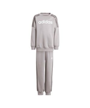 Infant adidas Sportswear Jogger Suit. When adventure calls they want to stay cosy through it all. This fleece adidas set keeps energetic kids warm whether they're building blanket forts or playing make believe with friends. Ribbed cuffs seal in heat while giving ankles extra stretch. Perfect for lounging yet durable enough for outdoor fun, this versatile set transitions from family movie night at home to imaginative adventures in the backyard. Sweatshirt:- Ribbed crew neck- Long sleeves.- Ribbed cuffs and hem.- Regular fit.- Main material: 70% Cotton, 30% Recycled polyester. Machine washable. Pants:- Elasticated waist.- 3-Stripes to sides.- Ribbed cuffs.- Regular fit.- Main material: 70% Cotton, 30% Recycled polyester. Machine washable. • Please note this style is sold as a set. • Returns will only be accepted if both items are returned together. Ref: IS6353.