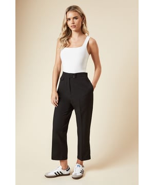 Chic capri-length trousers with distinctive tab detail
        High-waisted design for a flattering silhouette
        Side pockets for practicality
        Cropped length perfect for showcasing footwear
        Versatile regular fit suitable for various body types
    
    Embrace effortless style with these Dorothy Perkins Tab Detail Capri Trousers. The cropped length and regular fit make them an ideal choice for the fashion-conscious woman who values both comfort and trend-forward design. Perfect for casual daywear, these trousers can be styled with a crisp white top and trainers for a chic brunch look. The high-waisted design flatters the figure, while the tab detail adds a touch of sophistication. Pair with a lightweight blouse and sandals for family gatherings, or dress them up with a tucked-in silk camisole and ballet flats for an afternoon tea with friends. The versatility of these trousers makes them a wardrobe essential, easily transitioning from a relaxed weekend outfit to a smart-casual ensemble for informal work environments.