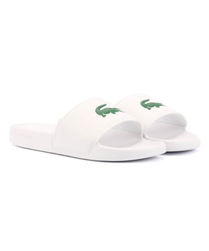 Slides featuring a smooth, rubberized upper for a sleek finish. Wide strap with bold logo detailing. Lightweight and durable design for all-day comfort.