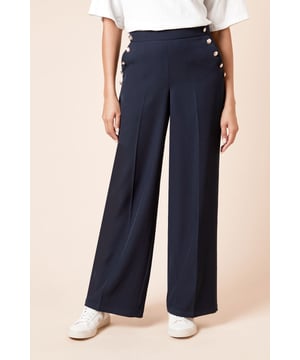 Wide leg silhouette for a comfortable and stylish fit
        Decorative military-inspired buttons along the side
        High-waisted design for a flattering shape
        Smooth woven fabric with a touch of stretch
        Versatile style suitable for various casual occasions
    
    Make a statement with these eye-catching wide leg trousers from Dorothy Perkins. The military-inspired button detail adds a touch of sophistication to the classic silhouette, perfect for the fashion-forward woman who appreciates a blend of comfort and style. The high-waisted design elongates your legs, while the wide leg cut offers ease of movement throughout the day. Style these trousers with a crisp white t-shirt and trainers for a chic brunch look, or pair them with a tucked-in blouse and ballet flats for a family gathering. The versatile nature of these trousers makes them ideal for various daytime events, from casual meetups with friends to relaxed weekend outings. The subtle stretch in the fabric ensures all-day comfort, allowing you to look effortlessly put-together without compromising on ease.