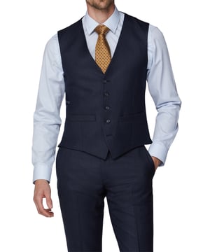 Update your formalwear collection with the 'Textured Tailored Fit Waistcoat' from Racing Green. The waistcoat is styled with a 5 button front and back strap with buckle. This contemporary waistcoat is a transitional piece that will take you from wedding to weekend. Wear smart with matching trousers, button down Oxford shirt and brown brogues.