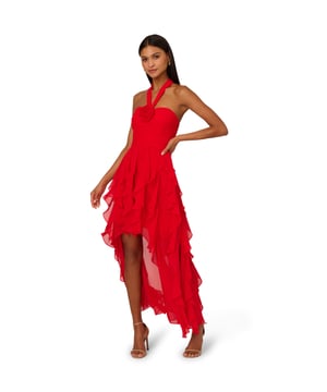 Make memories you will not forget in this high low halter dress. This dress features a halter neckline, gathered bodice with a 3D flowers accent at the centre of the bust, and a ruffled high low skirt. Crafted from mesh fabric, this dress has sultry sheer details at the skirt. This formal dress has an open back with covered button closure at the neckline and a hidden zipper at the centre back. Pair this high low dress with nude heels and a dramatic clutch for a statement-making night out.