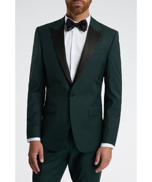 With roots tracing back to London's iconic Savile Row, Alexandre of England was established over a century ago, and it now holds the Royal Warrant from Queen Elizabeth II.Recapturing classic British tailoring with a modern spin, this Alexandre of England tuxedo jacket is tailored to perfection. Crafted from luxurious wool blend for guaranteed comfort and style at your next event, this piece features a sleek single-breasted design with a one-button fastening and satin peak lapel.With printed lining for added impact plus a half-canvas construction to maintain a sophisticated structure, you're sure to impress at any occasion when you pair this piece with its matching suit trousers.