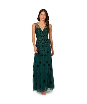 Subtle elements make this dress a show-stopping look. This formal dress features a crew neckline, halter bodice, and high-low skirt. Crafted from elegant crepe fabric, this evening gown has chic organza draping at the skirt and a comfortable level of stretch. A keyhole with a covered button closure and zipper back completes this crepe gown. Paired with metallic heels and a beaded clutch, this high-low gown is a sophisticated styling.