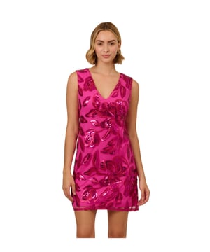 Cute and classy, this pink sleeveless cocktail dress sparkles with sequins set in an all-over floral pattern. A sheath silhouette with a V-neck makes this dress easy to wear and super flattering. The design is finished with a zipper closure. This pretty shimmering dress solves your outfit for girls night, date night, parties, and special events.