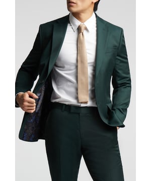 A classic recapture of British tailoring - Alexandre of England present the Bottle Green tailored fit suit jacket. Made with pure wool, for guaranteed comfort and style for any occasion.With a single-breasted, two button fastening, this jacket also features notch lapels, 2 straight flap pockets and printed lining for added impact.Perfect for pairing with a t-shirt and trainers for a sleek smart-casual look, or with a sharp shirt for effortless formalwear style.