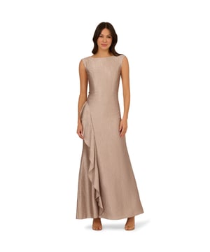 Expertly crafted with a textured jacquard fabric, this elegant sleeveless gown design creates a lustrous, shimmering finish. A fitted bodice with princess seams and a back zipper ensures a sleek mermaid silhouette. The high side slit adorned with ruffle accents offers comfortable wear and alluring movement. This opulent gown is perfect for your next formal event or special occasion.