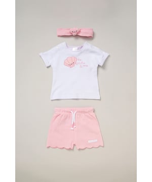 This outfit set by Rockabye Baby Boutique features cute scalloped edge comfy waffle shorts, a printed t-shirt, and a matching shell headband. Combining playful style and comfort, it's the perfect choice for your little one’s sunny days, offering a chic, coordinated look that's as adorable as it is comfy.