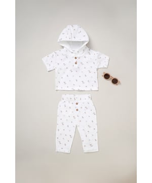 This Rockabye Baby Boutique outfit set  features a stylish hooded short sleeve shirt top with trousers, with an all-over fun print and matching sunglasses. Crafted from soft, breathable muslin material, our trendy outfits ensure ultimate comfort for your little one. Perfect for playful outings or sunny days ahead.