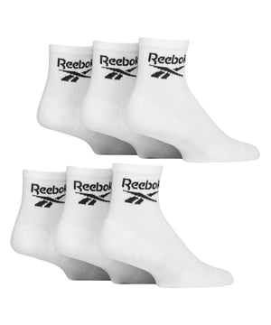 Reebok - 6 Pack Men's & Ladies Core Cotton Ankle Socks:  Reebok Core Cotton Ankle Socks are meticulously designed for everyday comfort, featuring an innovative ankle fit that stays discreetly hidden for that desired sockless appearance. Ideal for those who prefer an unobtrusive and minimalist style, these socks seamlessly blend into any outfit while maintaining maximum comfort throughout the day. These socks offer a great balance of softness, durability, and flexibility. Additionally, supportive elastic arch bands are incorporated into the design, offering a secure, snug fit around the foot's natural arch. These bands help to prevent sock slippage during movement, ensuring the socks stay in place without bunching or sliding down, even during intense physical activity. These ankle socks are made from a soft, smooth cotton blend that ensures breathability and a cool, comfortable feel all day long. The perfect blend of comfort and functionality, these socks are ideal for any activity. These everyday socks are crafted for enhanced comfort and durability, featuring soft terry cushioning strategically placed in the soles, heels, and toes. This extra layer of padding provides superior shock absorption, making them perfect for long hours of wear. They are constructed from a blend of 61% Cotton, 35% Polyester, 3% Elastane, and 1% Polyamide, they come in a 6 pair pack and are available in classic Black or White. These socks come in 3 sizes: 6-8, 8-10 and 10-12 UK are also machine washable at 40°, making them easy to care for. Extra Product Details: Reebok Core Ankle Socks Cotton Rich Fibres Invisible Under-Ankle Design Arch Support Bands Seamless Toe Soft & Breathable 6 Pairs Per Pack Machine Washable