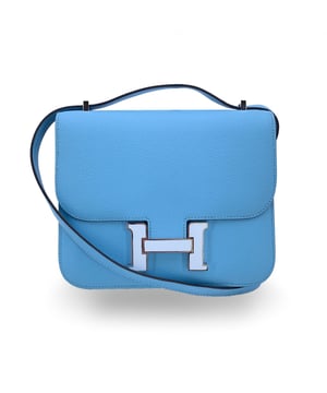 VINTAGE, RRP AS NEW
This beautiful Bag will come with a Certificate of ity provided by Entrupy, leading International Fashion ators. The certificate will be provided at no further cost  Hermès 'Constance 18' shoulder bag. This is a very iconic model by Hermes; legend has it that in 1967 Jean-Louis Dumas asked a designer to design a new bag model. The designer, who was pregnant, decided to give the bag the same name as her daughter, Constance. This model is crafted from light blue celeste Epsom leather with silver metal hardware. Flap with H clasp on the front enameled in white. Leather lining. 2 main sections inside. 3 side open pockets inside. The shoulder strap can be worn in two ways: longer or shorter, doubled. Mini mirror inside. 'HERMES Paris - Made in France' embossed under the flap. Condition Rating: A - EXCELLENTCondition Details: Minimal scratches on the rteverse of the flap. Hermes box and dustbag included. Please check the photos carefully and ask if you need to know more details or if you have any doubts.Measurements (cm):Depth: 3.8Height: 14.0Length: 17.8Other Details: Dustbag? YesKeys? NoBox? Yes Measurments:  width: 38 mm length: 178 mm height: 140 mm