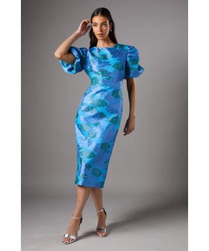 Striking jacquard fabric with a floral pattern
        Elegant midi length for a sophisticated silhouette
        Dramatic puff sleeves add a touch of romance
        Figure-flattering fitted bodice
        Round neckline for a classic finish
    
    Make a statement at your next special occasion with this exquisite midi dress from Coast. The jacquard fabric creates a luxurious texture, while the floral pattern adds a touch of femininity. The fitted bodice accentuates your curves, flowing into a sleek midi skirt that's perfect for elegant events. The puff sleeves create a romantic silhouette, balancing the streamlined shape of the dress. Style this versatile piece with strappy metallic heels and delicate drop earrings for a wedding or the races. For a more understated look, pair it with nude court shoes and a clutch bag for a sophisticated evening out. This dress is a true wardrobe investment, suitable for a range of formal events from garden parties to cocktail receptions.