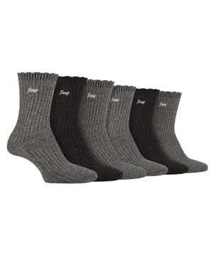 Jeep Ladies 6 Pack Scalloped Cuff Socks: Introducing the Jeep Bamboo Scalloped Top Socks, a delightful triple pack of ladies' socks that exude comfort and elegance. Crafted from an 88% Bamboo, 10% Polyester, and 2% Elastane blend, these socks offer a super-soft and silk-like feel. The fine gauge design features ribbed legs and scalloped edge cuffs for a touch of sophistication. These bamboo socks are not only a treat for the eyes but also a blessing for your feet. Bamboo, known for its gentle nature, suits all skin types, making it a perfect choice for those with sensitivities. The natural properties of bamboo include bacteria and fungal resistance, ensuring freshness throughout wear. Additionally, these socks have superior moisture-absorbing capabilities compared to cotton socks, providing a dry and comfortable feel. Wear these luxurious bamboo socks in any season, as they possess inherent thermoregulating abilities that adapt to changing temperatures. Whether you're donning shoes or boots, these socks promise a great fit and a stylish look. Each pair is elegantly embroidered with a contrasting Jeep logo, completing the perfect trio of colors and comfort. Machine washable at 40°, maintenance is effortless, so you can enjoy the pleasure of these bamboo socks again and again. Treat your feet to the indulgence they deserve with Jeep Bamboo Scalloped Top Socks. Extra Product Details: Delightful ladies' socks with comfort and elegance. 88% Bamboo, 10% Polyester, 2% Elastane blend for a silk-like feel. Gentle on all skin types, perfect for sensitivities. Bacteria and fungal resistant, ensuring lasting freshness. Superior moisture-absorption for a dry, comfortable experience. Inherent thermoregulating abilities for year-round wear. Stylish design with ribbed legs and scalloped cuffs. Effortless maintenance, machine washable at 40°.