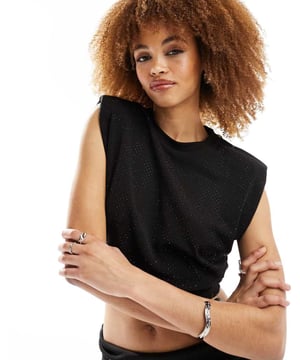 Tops by AllSaints Can't top this Crew neck Padded shoulders Sleeveless style Diamante embellishment Regular fitSold By: Asos