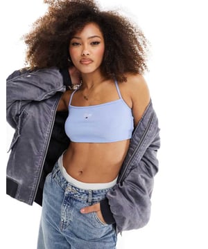Tops by Tommy Jeans Can't top this Halterneck style Logo embroidery Cross-back straps Cropped length Slim fitSold By: Asos