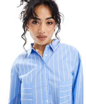 Lingerie & Nightwear by Luna Part of a co-ord set Trousers sold separately Spread collar Long sleeves Button placket Chest pockets Oversized fitSold By: Asos