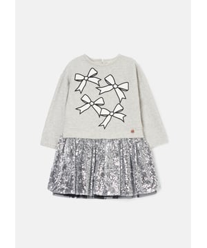 Is it a sweatshirt. is it a dress?… It's both! And it's fabulous! A super soft cotton sweat top with a bow print and a fully embellished   sequin skirt. The perfect hybrid of smart casual.