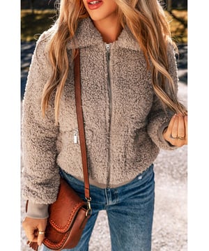 Zipper front design for easy wear on and off
  Two convenient pockets to keep your essentials close
  Fuzzy material for warmth and comfort
  Stylish design for cold weather fashion
  Available in multiple sizes (refer to size chart)