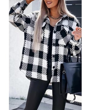 Black plaid textured shacket
  Versatile piece for different styling options
  Flap pocket on the front for essentials
  High
  quality materials for durability and longevity
  Suitable for both casual and formal occasions