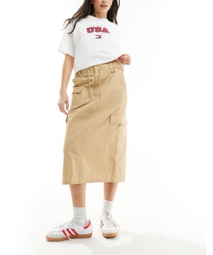 Skirts by Tommy Jeans Lower-half looks High rise Drawstring waist Functional pockets Kick split Regular fitSold By: Asos
