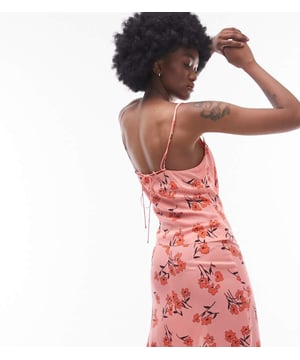 Tops by Topshop Tall Welcome to the next phase of Topshop Skirt sold separately Floral design Sleeveless style Tie back Regular fitSold By: Asos