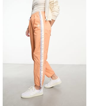Trousers & Leggings by AAPE BY A BATHING APE® These are going to be *well loved* High rise Toggle waist and cuffs Functional pockets Regular, tapered fitSold By: Asos
