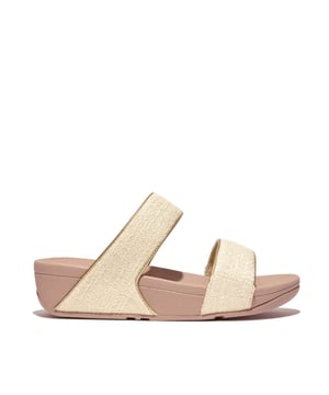 De Lulu slippers van FitFlop zijn klassiekers. Blijvend populair, ze zijn zacht gevoerd en kunnen omhoog of omlaag gekleed worden. Ze staan op FitFlop's legendarische super dempende Microwobbleboard™ tussenzool. Dit seizoen uitgevoerd in een glinsterende stof met een chique 'tweedy' uitstraling. Afgerand met metallic parelmoeren biezen van imitatieleer voor extra glans. Subtiel glinsterende sandalen die je overal bij kunt dragen en prachtig zijn van dag tot nacht.