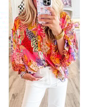 Red Abstract Floral Print
  Buttoned front
  Ruffled bubble sleeves
  Abstract floral print design
  Available in various sizes
Material: 100% Polyester