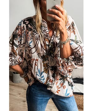 Camisa suelta y casual que permite un fácil movimiento. Impresión floral blanca para un look fresco y relajado todos los días. Botones en la parte delantera para opciones de estilo versátiles. Mangas tipo globo a la moda. Diseño unisex. Material: 100% Poliéster.