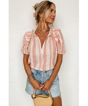 Red frilled blouse
  Dotty mixed print
  Tie split neck
  Frilly decors
  Short puff sleeves
  Soft and lightweight cotton
  Perfect for summer fashion
  Pair with denim shorts and flat sandals for a vacation look
  Size chart (in CM and INCH) provided
Material: 100% Viscose