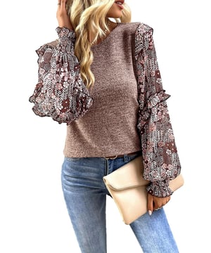 Floral blouse with a charming and eclectic style
  Ruffle detailing along the sleeves for a playful and romantic vibe
  Perfect blend of modern trends and feminine accents
  Puff sleeves add a touch of elegance and femininity
Material: 65% Polyester 30% Viscose 5% Elastane