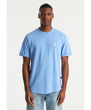 Das Brody Slub ist ein Regular-Fit-T-Shirt mit Garment-Dye-Färbung. Versehen mit charakteristischen CHASIN'-Details.