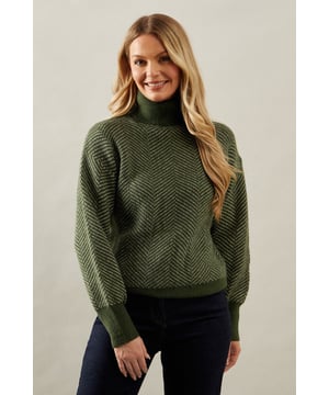 Striking chevron stitch pattern adds visual interest
        Cosy roll neck design for extra warmth
        Relaxed fit with dropped shoulders for comfort
        Ribbed cuffs and hem for a snug finish
        Versatile knit suitable for various occasions
    
    Embrace sophistication and comfort with this exquisite Chevron Stitch Roll Neck Jumper from Wallis. The eye-catching chevron pattern radiates elegance, while the roll neck design offers both style and warmth. Perfect for those chilly autumn days or cosy winter evenings, this jumper effortlessly transitions from day to night. Pair it with dark wash jeans and ankle boots for a casual yet polished look, ideal for family gatherings or weekend brunches. For a more refined ensemble, team it with tailored trousers and heeled loafers, making it suitable for informal work settings or dinner dates. The relaxed fit ensures ease of movement, while the textured knit adds a touch of luxury to your wardrobe. This versatile piece is a must-have for the fashion-conscious woman who values both style and comfort in her everyday attire.