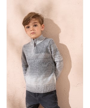This knit is ready to take on chilly days! Super soft yarn in stylish   ombre with a funnel neck and 1/4 zip opening. Wear with denim or cargos.