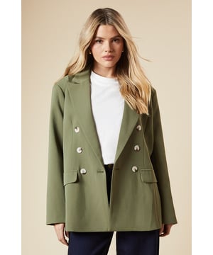 Oversized fit for a relaxed and comfortable silhouette
        Double-breasted design with stylish button detailing
        Notched lapel collar adds a classic touch
        Long sleeves with subtle shoulder padding for structure
        Versatile woven fabric suitable for various occasions
    
    Embrace effortless sophistication with this oversized double-breasted blazer from Dorothy Perkins. Perfect for the fashion-forward woman in her 30s who appreciates a blend of trend and comfort. The relaxed fit allows for easy layering over your favourite tops, while the classic double-breasted front presents a polished look. Style it with wide-leg jeans and trainers for a chic brunch ensemble, or throw it over a midi dress for a baby shower. The versatile nature of this blazer makes it an ideal choice for family gatherings and casual outings. Its neutral tone ensures it pairs well with various colours in your wardrobe. For a trendy twist, roll up the sleeves and add some statement jewellery. This blazer is your go-to piece for elevating everyday looks with minimal effort.