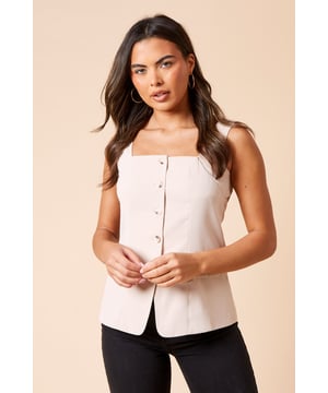 Longline silhouette for a sleek, elongated look
        Button-through front closure for versatile styling
        Square neckline adds a modern, feminine touch
        Flap pockets at the waist for functional detail
        Sleeveless design perfect for layering
    
    This Dorothy Perkins longline waistcoat is a versatile piece that will quickly become a staple in your wardrobe. The regular fit ensures comfort while maintaining a polished appearance, ideal for the fashion-forward woman in her 30s. Style it over a crisp white shirt and pair with wide-leg trousers for a chic office ensemble. For a more casual look, layer it over a simple tee and team with your favourite jeans and trainers for weekend brunches with friends. The button-through design allows for easy customisation - wear it open over a flowy dress for a relaxed garden party or buttoned up as a standalone top for a trendy twist. This waistcoat is perfect for those who like to follow trends without showing too much skin, making it an excellent choice for family gatherings or baby showers. Its versatility ensures you'll find countless ways to incorporate it into your everyday style.