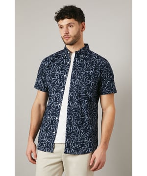 Striking palm print design for a tropical-inspired look
        Short sleeves for warm-weather comfort
        Classic collar for a smart-casual appearance
        Button-down front for easy wear
        Versatile woven cotton fabric for breathability
    
    Embrace the laid-back charm of summer with this eye-catching palm print shirt from Maine. Perfect for casual outings and relaxed gatherings, this short-sleeved wonder offers both style and comfort. The classic collar and button-down front allow for effortless dressing, whilst the all-over print adds a touch of personality to your ensemble. As seen on our model, pair it with light-coloured trousers and crisp white trainers for a fresh, coordinated look. Whether you're heading to a family barbecue, a casual date, or a day out with mates, this shirt is your go-to for effortless style. Layer it over a plain white tee for added versatility, or wear it open over a vest on particularly warm days. The possibilities are endless with this adaptable piece that's sure to become a staple in your warm-weather wardrobe.