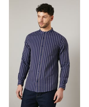 Distinctive grandad collar for a modern twist
        Vertical stripes create a slimming effect
        Long sleeves with button cuffs for versatility
        Convenient chest pocket for small essentials
        Relaxed fit for all-day comfort
    
    This Maine grandad collar shirt offers a contemporary take on casual style. The vertical stripes elongate the silhouette, while the relaxed fit ensures comfort for various body types. Perfect for laid-back weekends or casual Fridays at the office, this shirt can be styled effortlessly with dark denim jeans and white trainers for a smart-casual look. Layer it under a lightweight jacket for cooler evenings or wear it open over a plain t-shirt for a more relaxed vibe. The versatile design makes it suitable for family gatherings, pub outings with mates, or casual dates. The grandad collar adds a touch of sophistication, allowing you to dress it up with chinos and loafers for semi-formal occasions. Easy to care for and comfortable to wear, this shirt is set to become a staple in your wardrobe, offering endless styling possibilities for the modern British gent.