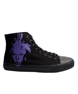 The Calvin Klein x Andy Warhol high-top sneakers are a collaboration that fuses contemporary fashion with iconic 20th-century art. This special edition features a design that pays homage to legendary pop artist Andy Warhol, integrating his signature aesthetic into a modern and versatile shoe.

 Characteristics:

 - High-top design: These men's sneakers feature a cut that covers the ankle.
 - Graphics by Andy Warhol.
 - Made of durable canvas.
 - Adjustable lacing system for a custom fit.
 - Rubber sole with anti-slip properties.
 - Calvin Klein Jeans logo on the heel.

 This collaboration between Calvin Klein and the Andy Warhol Foundation was launched in 2018, under the creative direction of Raf Simons, who sought to integrate Warhol's artistic legacy into contemporary fashion pieces. The high-top sneakers are available in various color combinations and graphics, allowing fashion and art enthusiasts to choose the one that best suits their personal style.

 These men's high-top sneakers are not only a fashion statement, but also a celebration of pop art and its enduring influence on modern culture.
 Composition: Exterior: Textile; Interior: Textile; Sole: Rubber; Insole: Textile
 Care:
Dry brush with soft bristles to remove dirt.
 Avoid water and humidity; clean with a damp cloth and neutral soap.
 Air dry, without direct sunlight or heat sources.